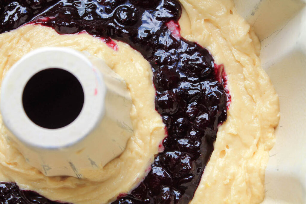 Making a blueberry swirl in a bundt cake