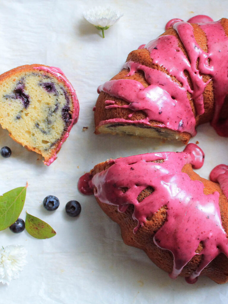 Blueberry swirl cake with a slice taken out of it
