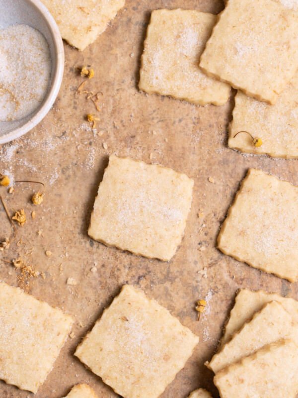 Freshly baked chamomile shortbread cookies on a sheet pan