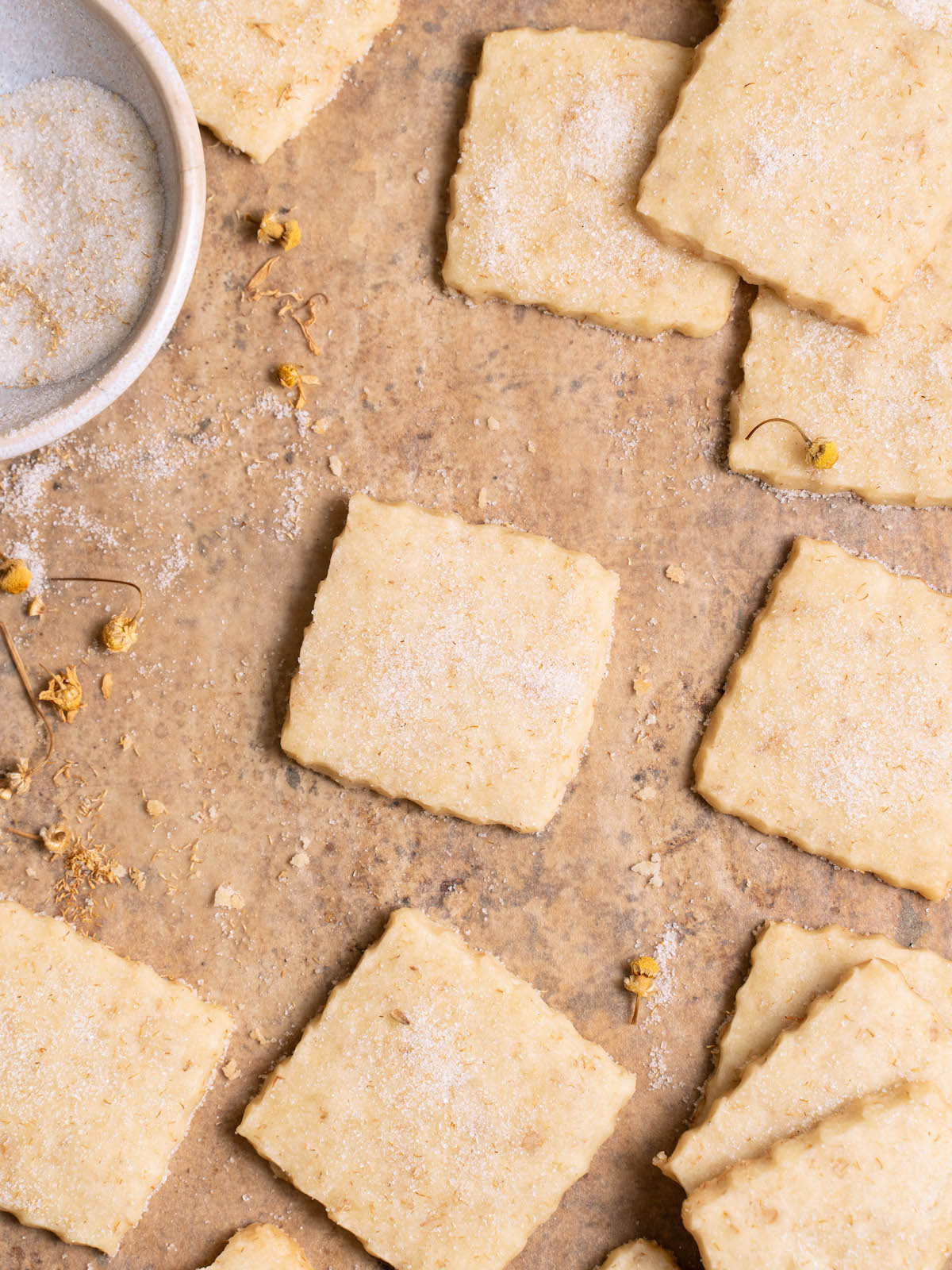 Freshly baked chamomile shortbread cookies on a sheet pan