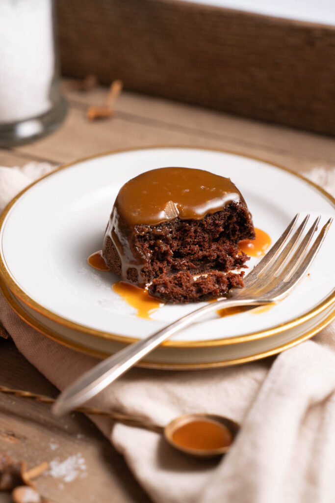 A mini chocolate caramel cake served up on a plate