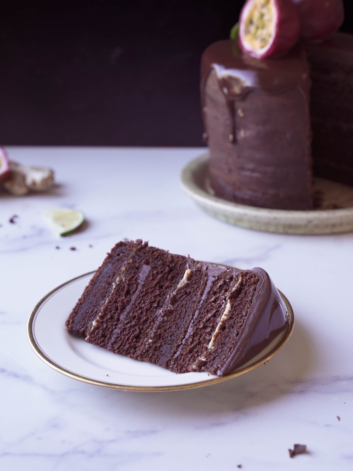 A slice of chocolate passionfruit cake on a plate