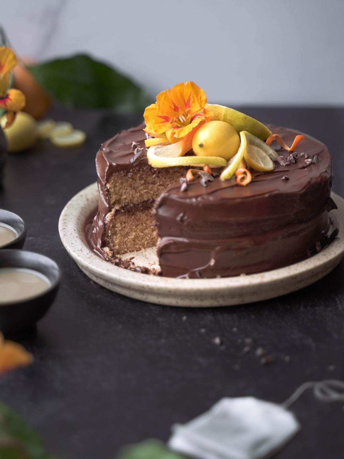 A chocolate earl grey cake with a slice removed