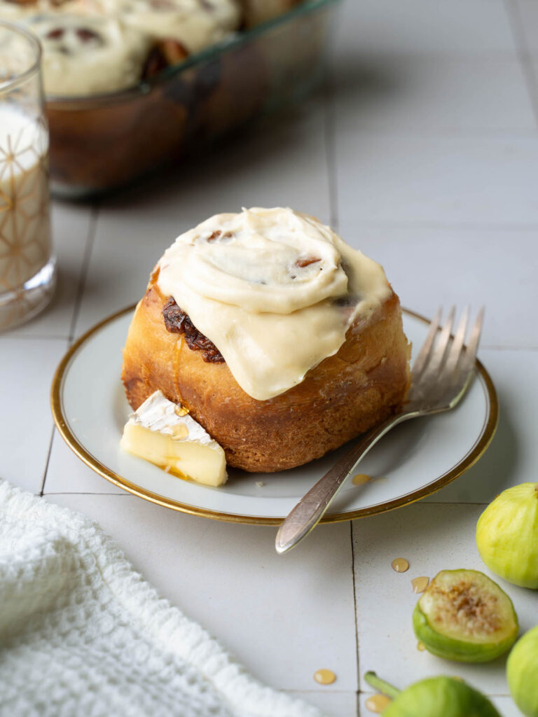 A fig and brie cinnamon roll on a plate