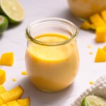 Homemade mango curd in a glass jar