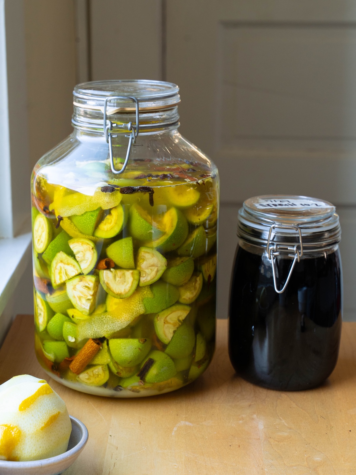 Nocino infusing in a bottle, and Nocino after months of infusing