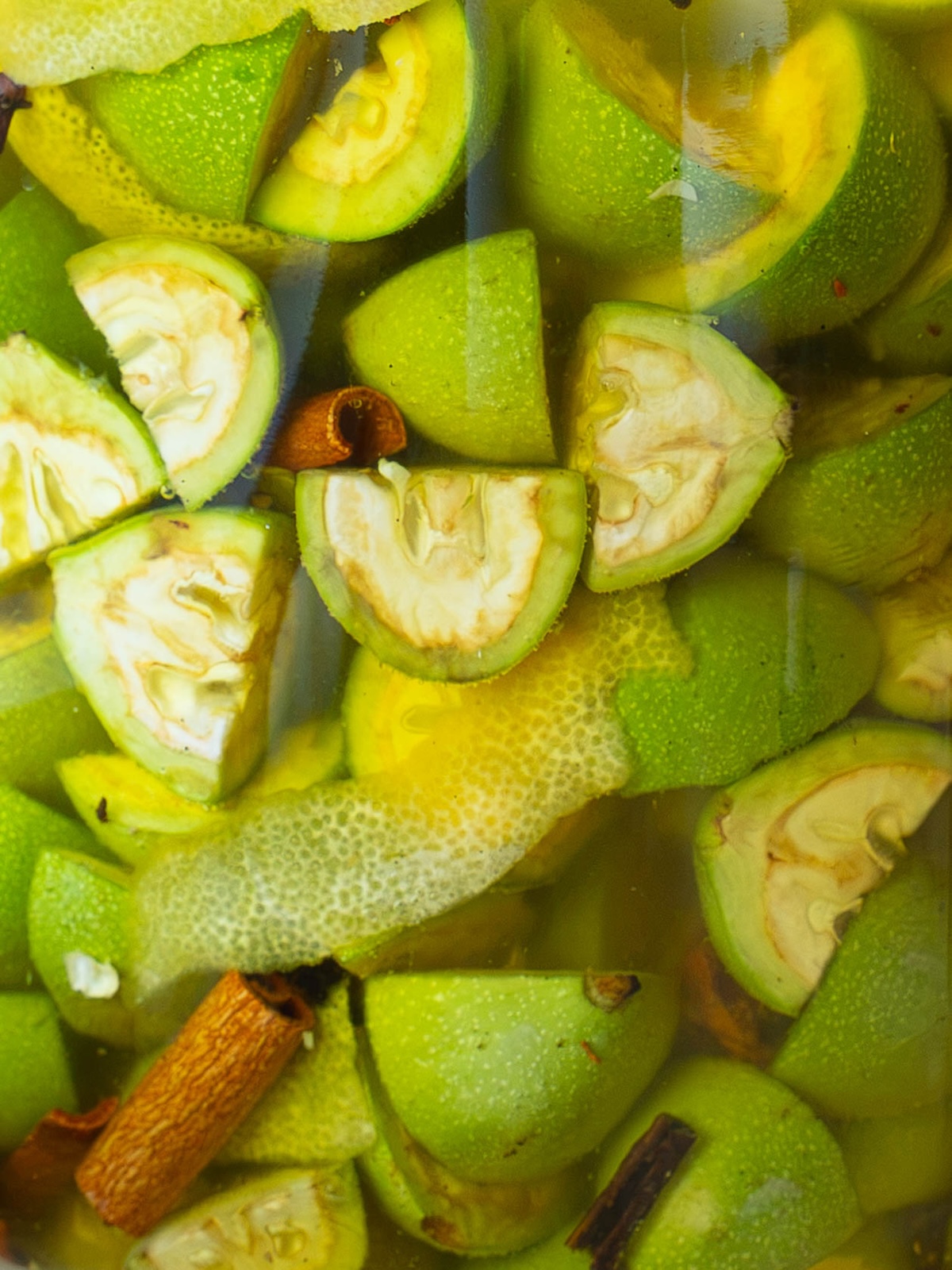 Green walnuts and whole spices infusing in vodka for a batch of Nocino