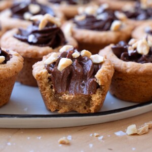 A bite taken out of a peanut butter chocolate cookie cup