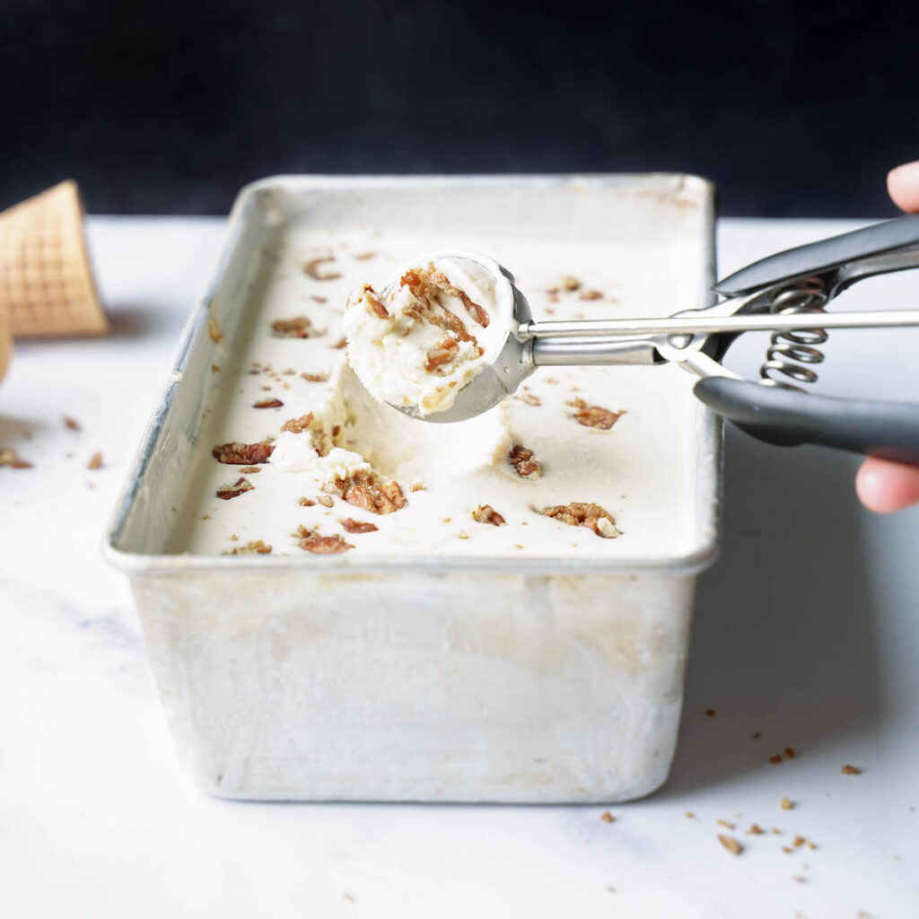 Scooping peach pecan ice cream