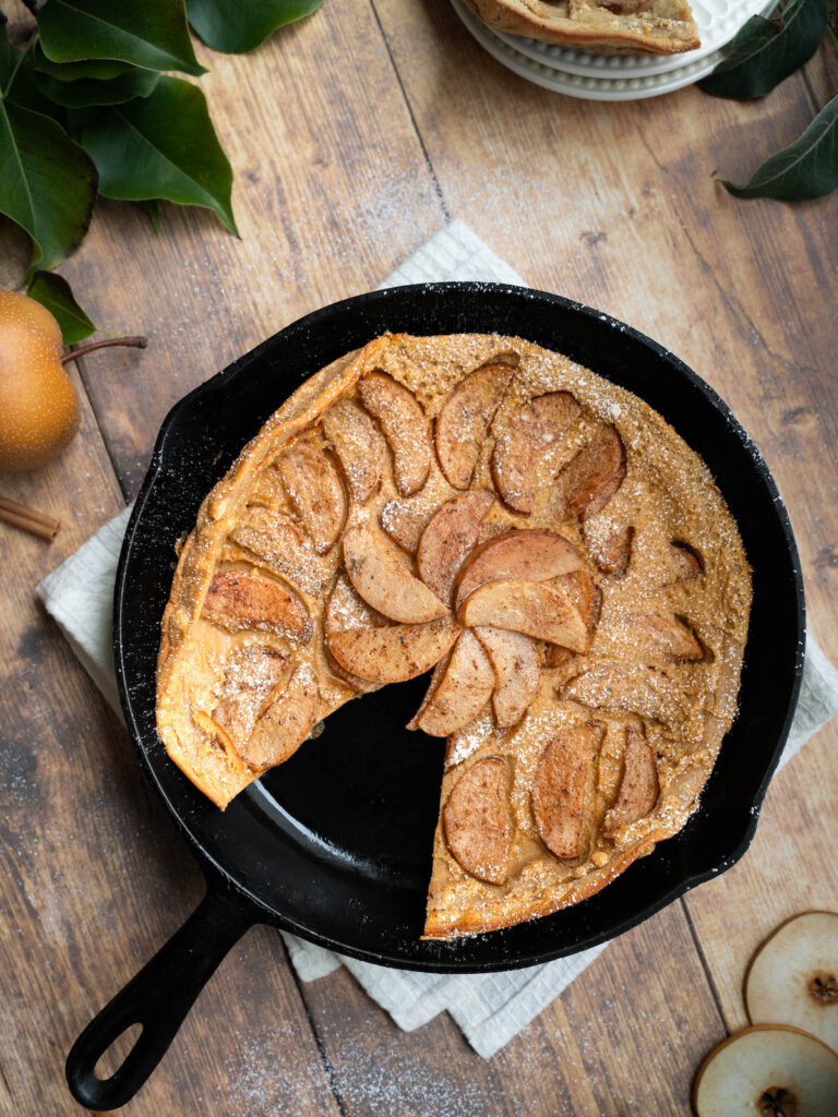 A pear clafoutis made in a cast iron