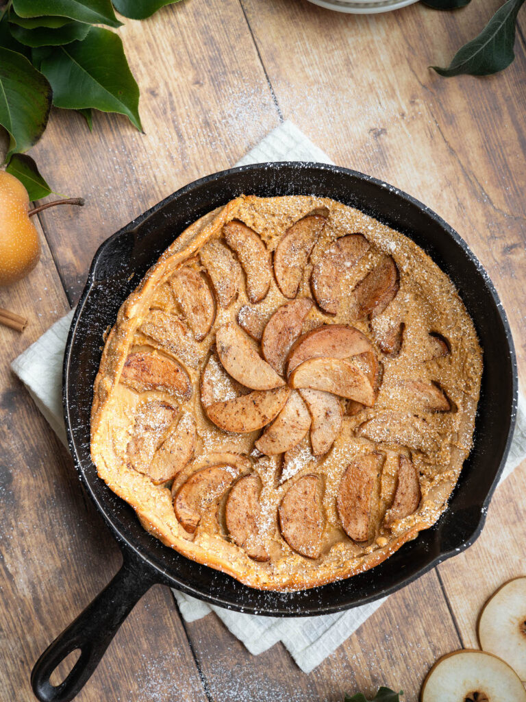 Pear clafoutis made in a cast iron pan