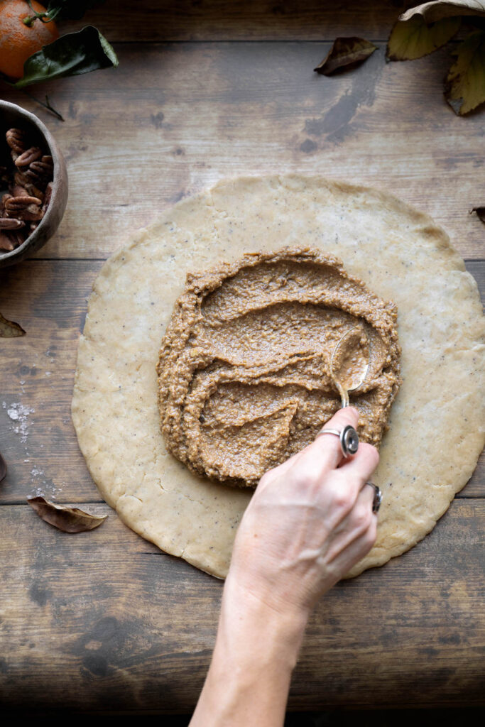 Spreading pecan frangipane onto galette dough