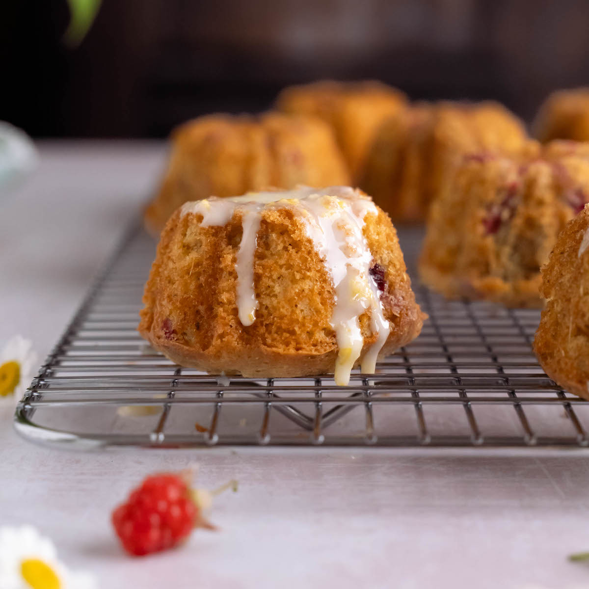 Mini raspberry cake glazed with lemon icing