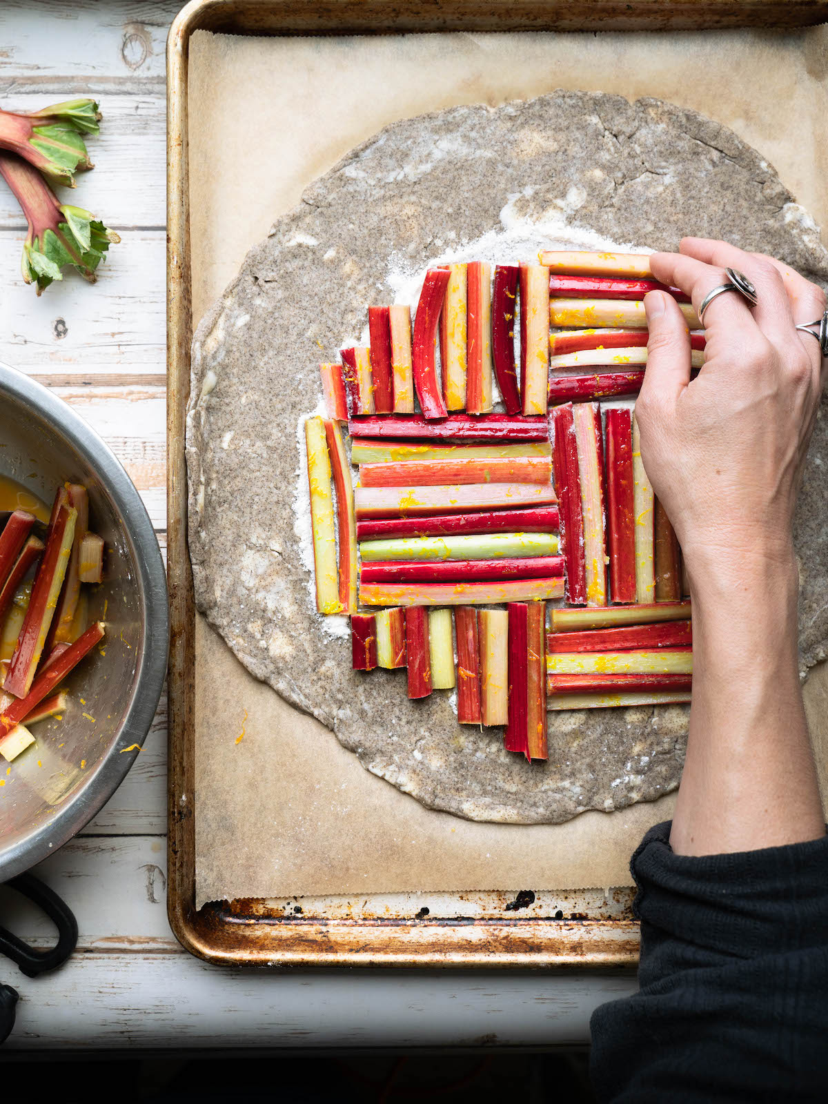 Using rhubarb pieces to make a fun design on a rhubarb galette