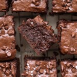 A bunch of sourdough brownies, with one turned over to show side view