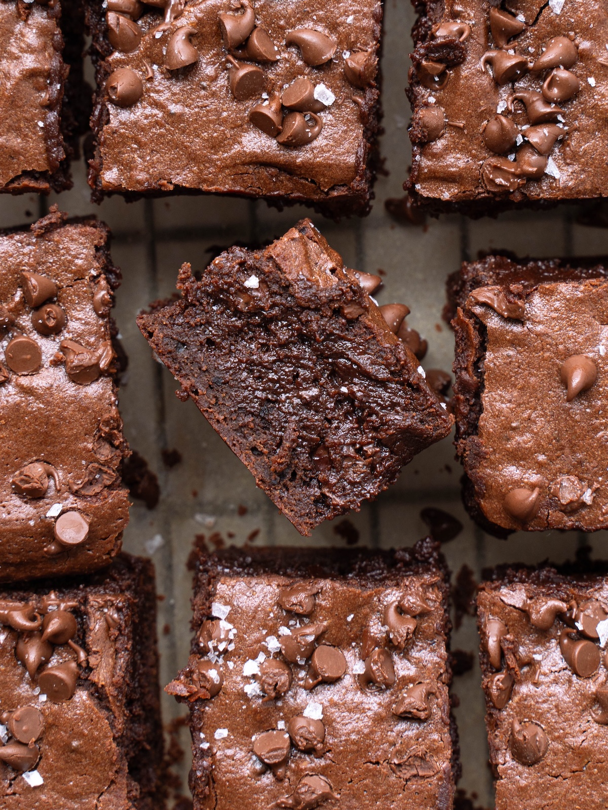 A bunch of sourdough brownies, with one turned over to show side view