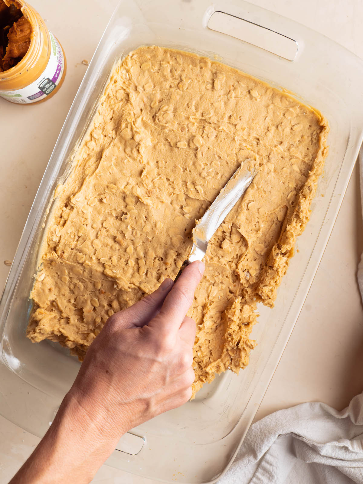 Spreading cookie dough into a pan