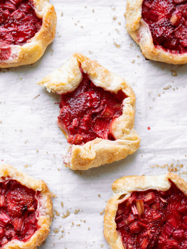 Strawberry rhubarb galettes on a baking tray