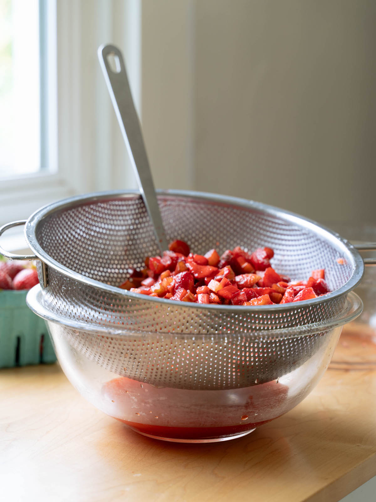 Strawberries and rhubarb macerating, creating a natural syrup