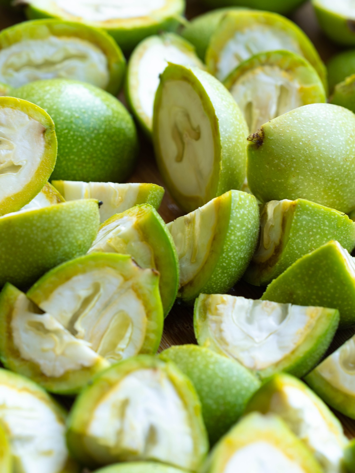Unripe walnuts cut into quarters
