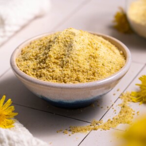A tiny bowl full of dandelion flower sugar