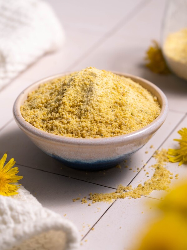 A tiny bowl full of dandelion flower sugar