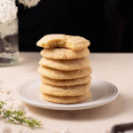 A stack of lilac snickerdoodle cookies on a plate