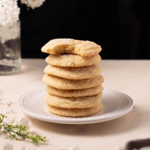 A stack of lilac snickerdoodle cookies on a plate