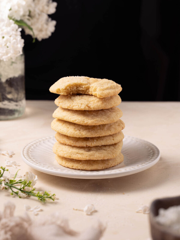 A stack of lilac snickerdoodle cookies on a plate
