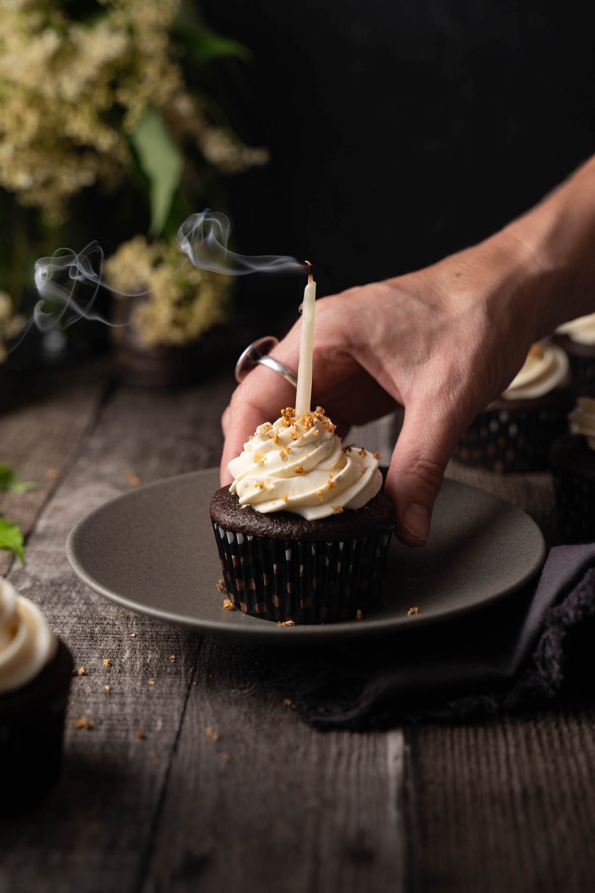 A cupcake with a birthday candle in it