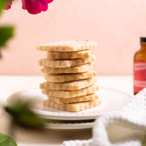 A stack of rose shortbread cookies on a plate
