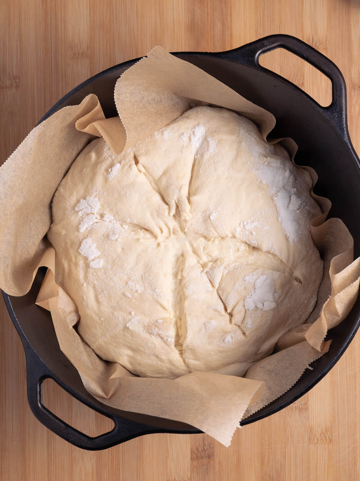 Garlic & parmesan sourdough bread in a dutch oven, ready to bake