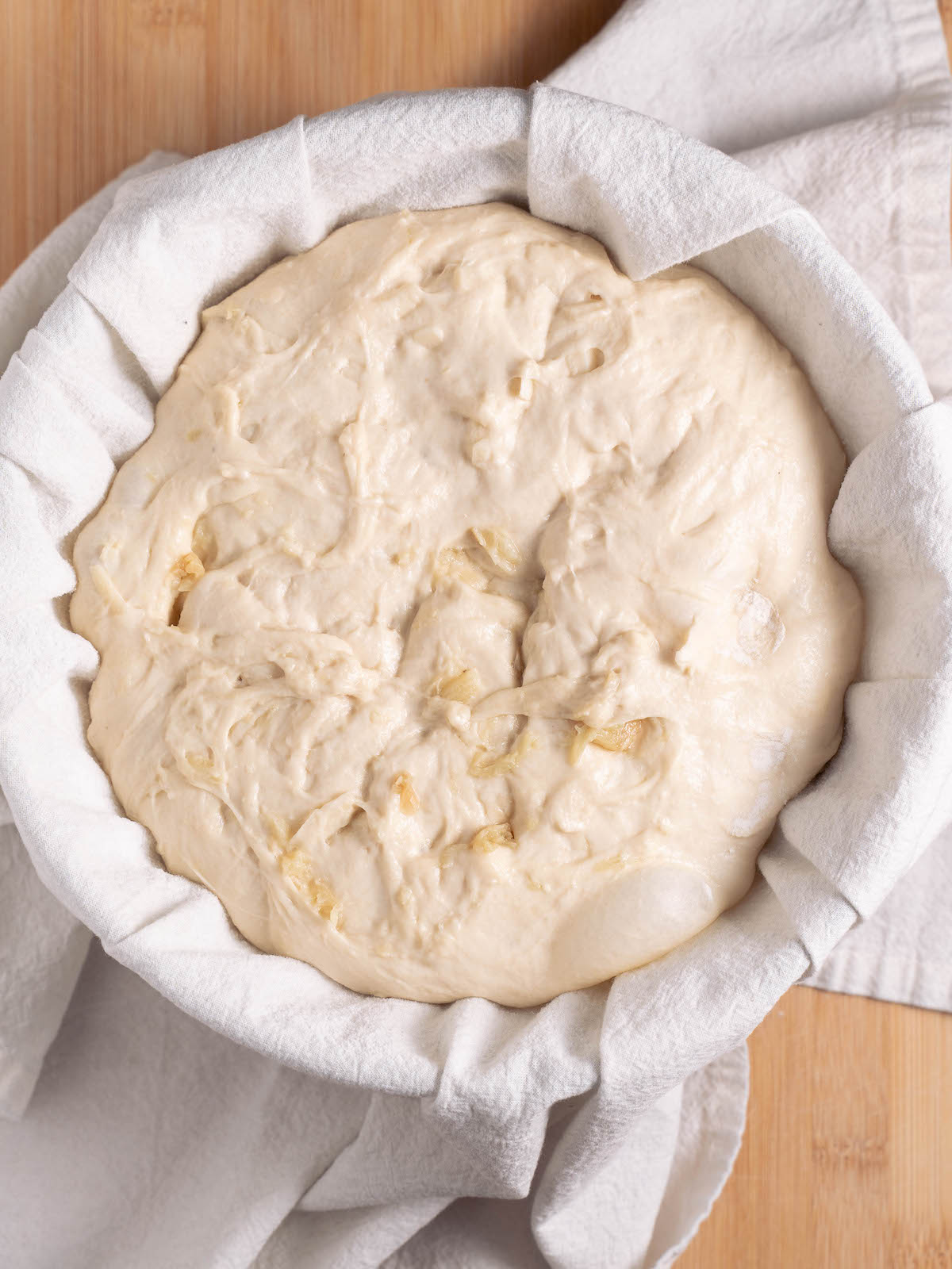 Bubbly roasted garlic sourdough perfectly proofed