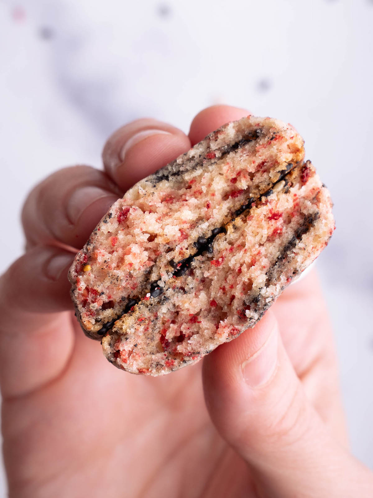 A cookie broken in half to show swirl inside