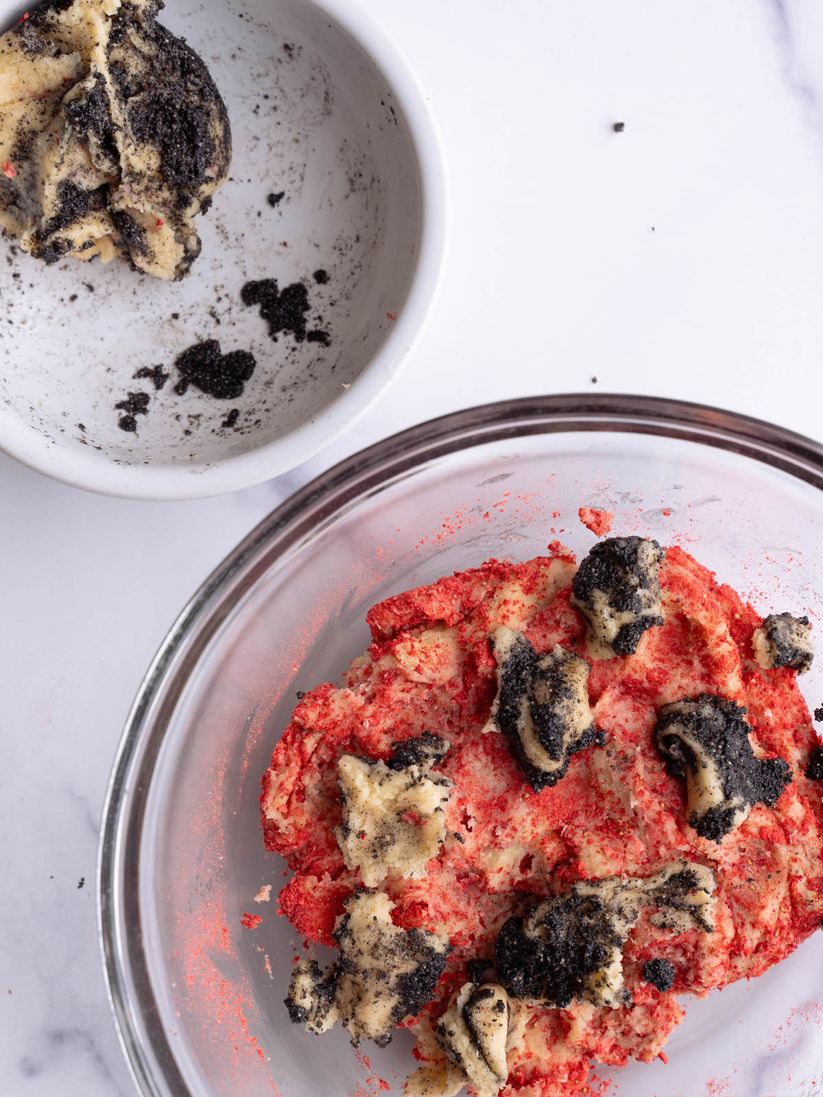 Swirling strawberry and black sesame cookie dough together