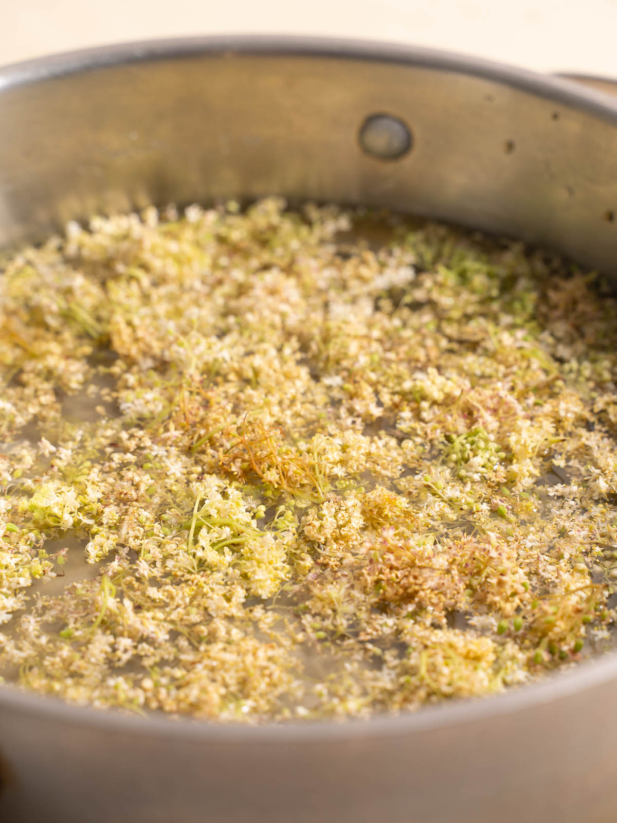 Infusing elderflowers in simple syrup