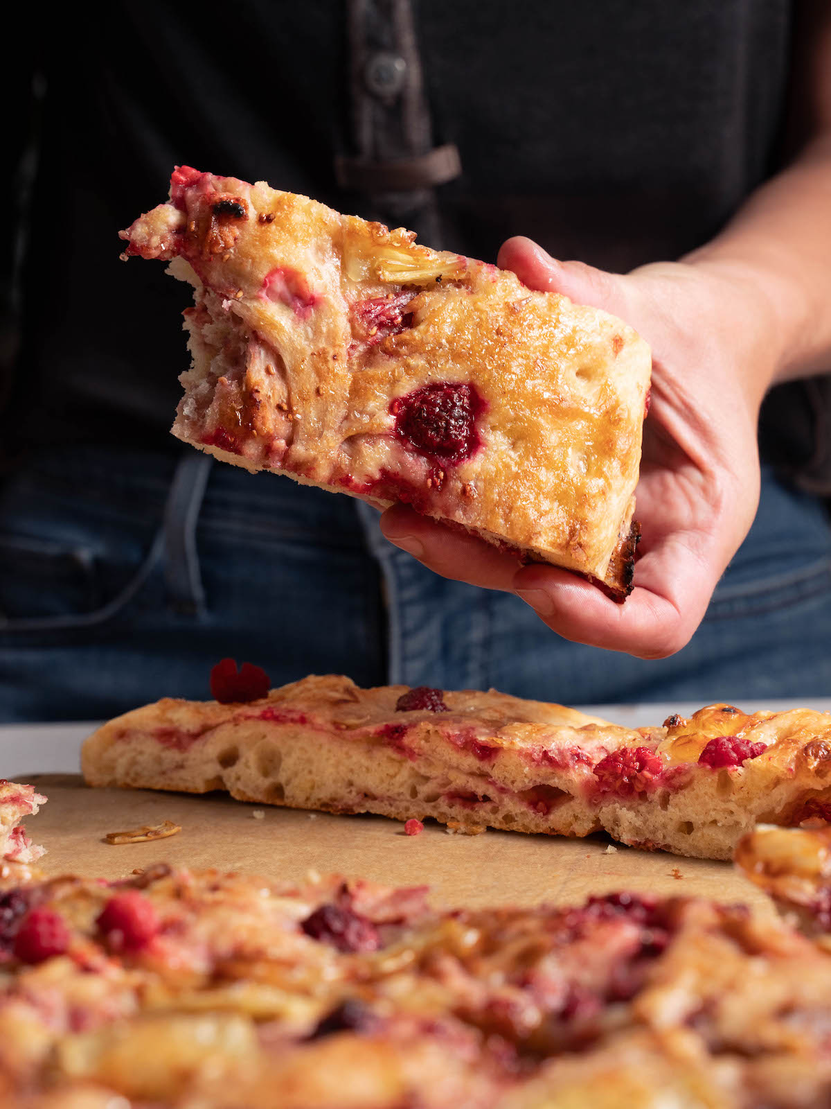The top of a loaf of raspberry focaccia bread