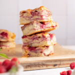 Squares of raspberry brie focaccia bread stacked on top of each other