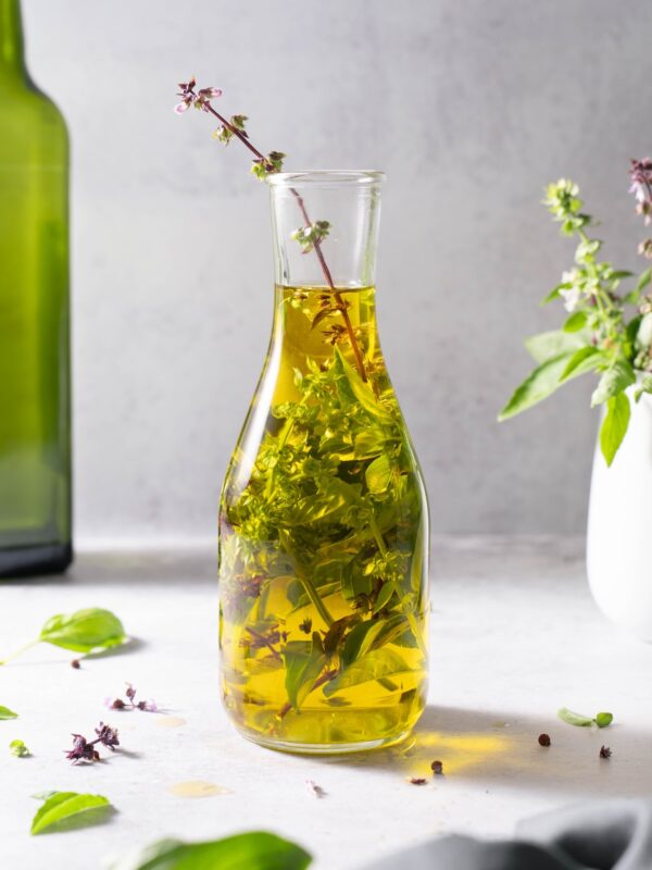 Basil flower oil in a jar