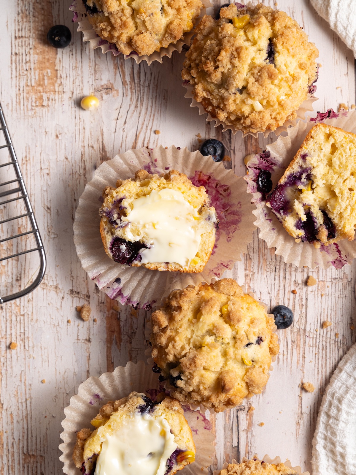 Muffins, whole and split open & buttered
