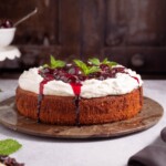 A one-layer ricotta cake topped with stewed cherries and crème fraîche