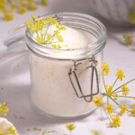 A jar full of sugar infused with fresh fennel pollen