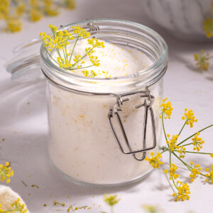 A jar full of sugar infused with fresh fennel pollen