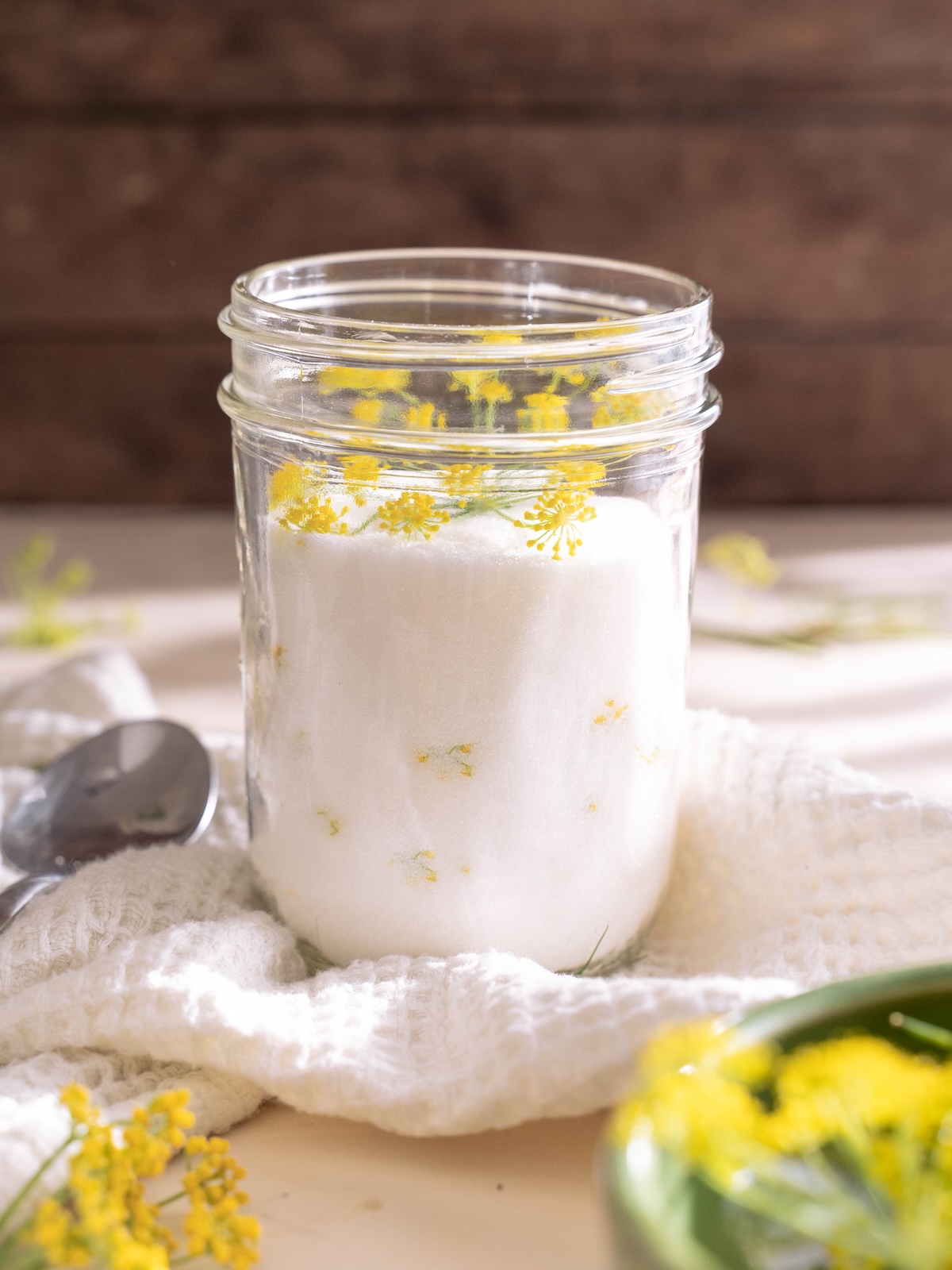 A jar of layered sugar and fennel flowers