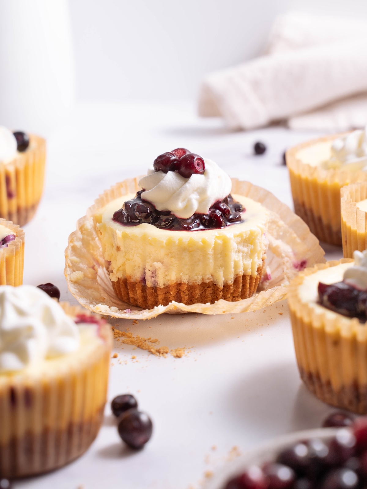 Miniature cheesecakes, topped with wild huckleberry compote