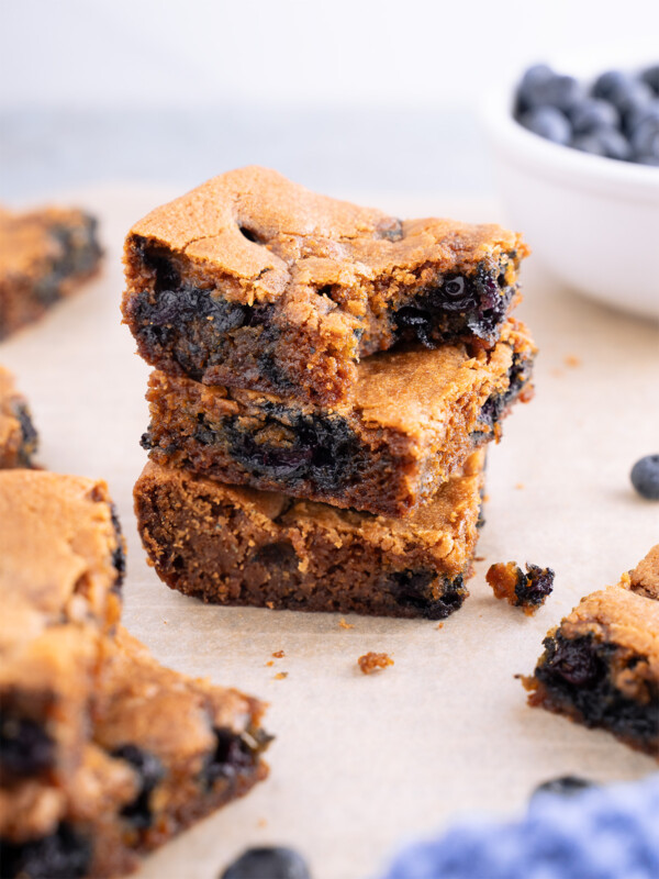 Three lemon blueberry blondies stacked on top of each other