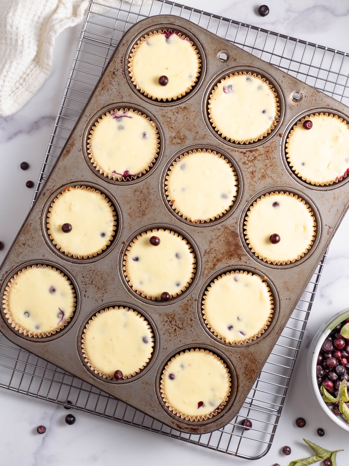 Miniature huckleberry cheesecakes after baking