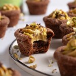 Chocolate cookie cups filled with pistachio cream cheese frosting