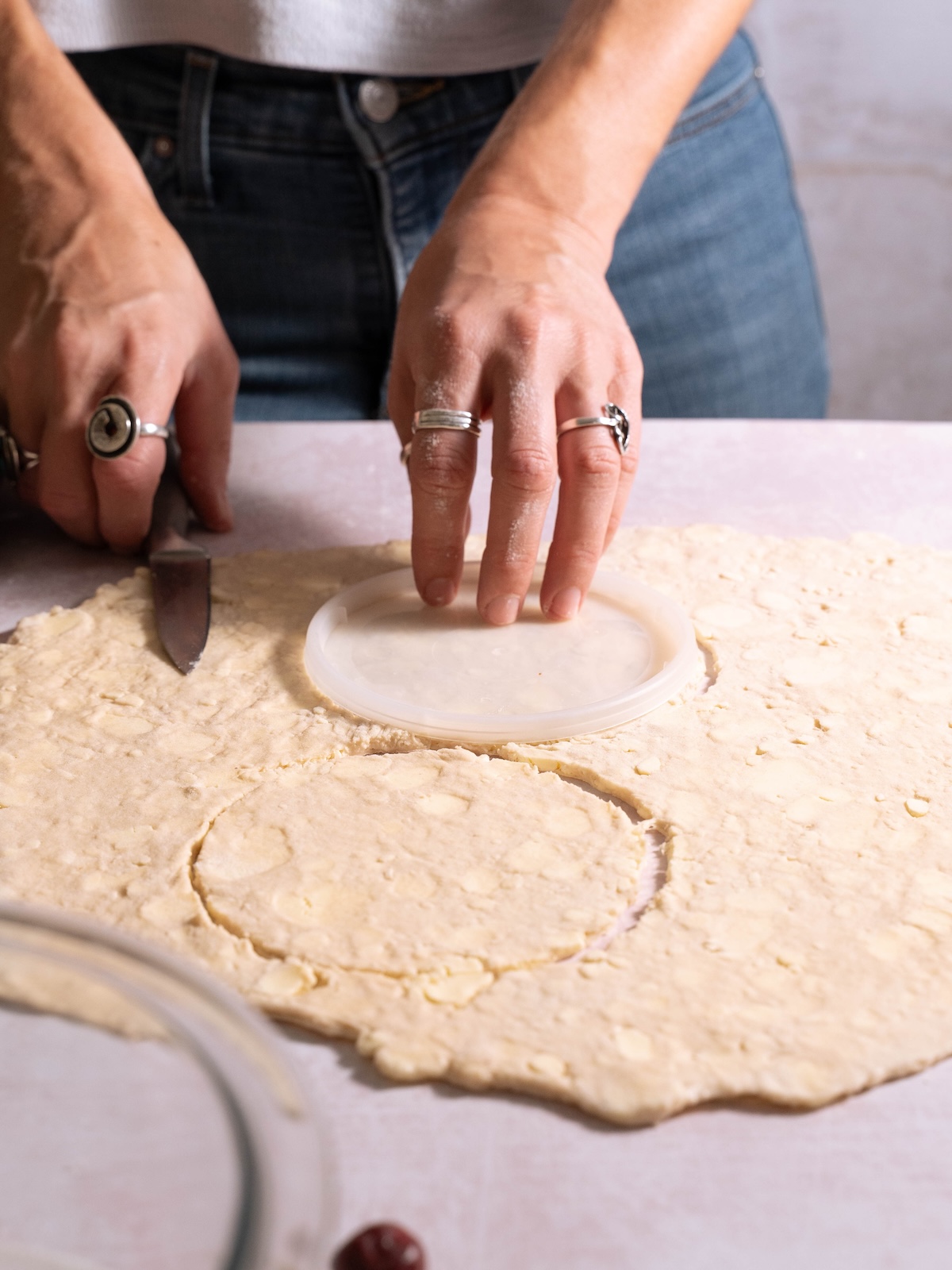 Cutting circles out of pie dough to make hand pies