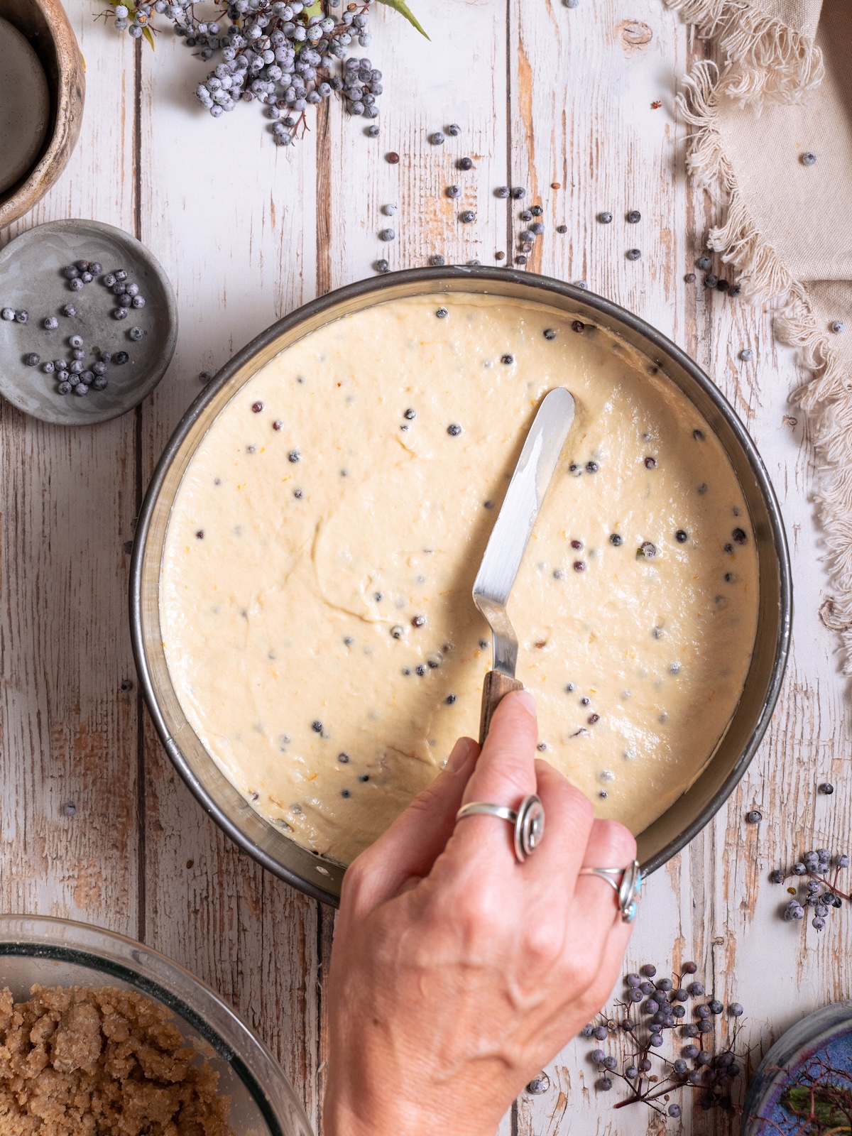 Smoothing out coffee cake batter before baking